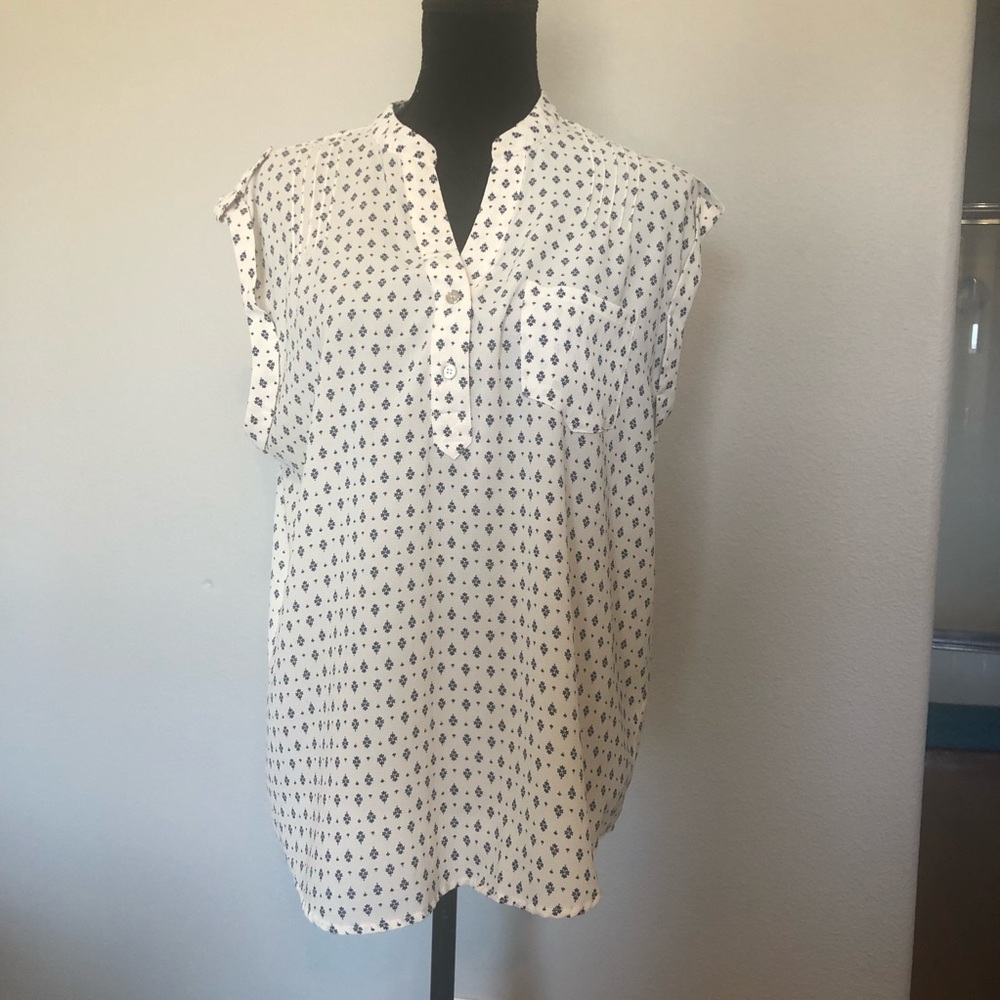 White blouse with blue flowerish design